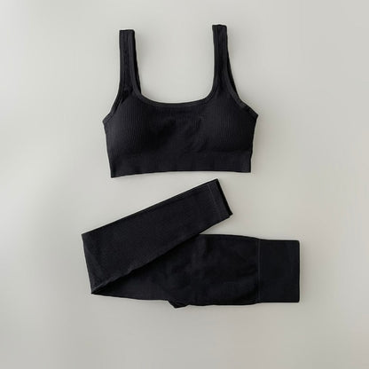 Two-piece Yoga Clothing Set with high-waisted, seamless leggings and a versatile, airy top for comfort and style during any workout.