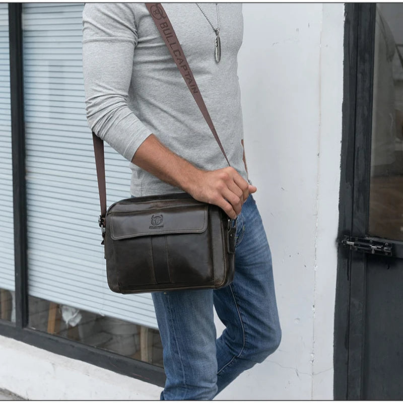 This genuine leather briefcase by Bull Captain is a stylish and functional accessory designed to carry and organize daily essentials in a professional setting