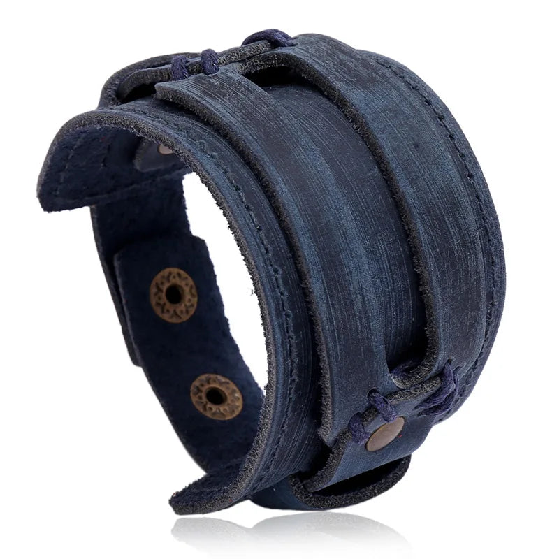 Men’s leather bracelet with steel snap clasps: punk-inspired, available in vibrant colors for a bold, nostalgic look.