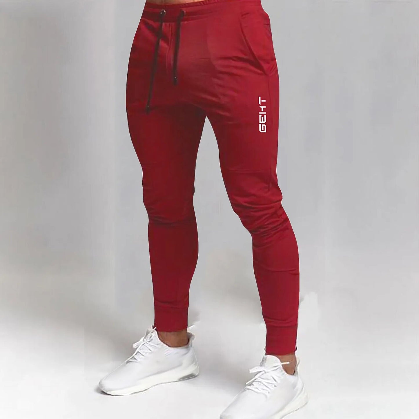 Men's red athletic workout joggers designed for comfort, performance, and style.