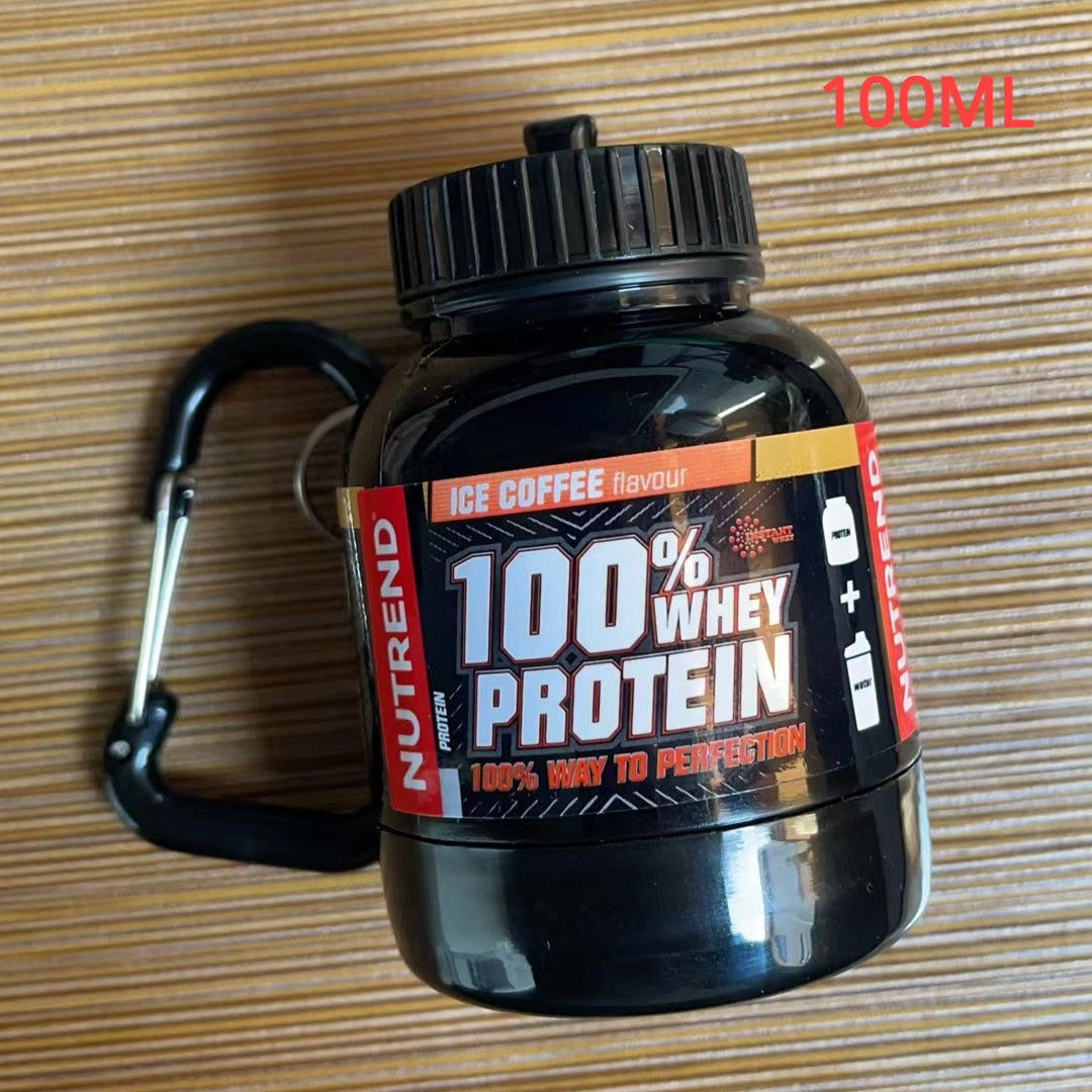 Portable Protein Powder Bottle with keychain attachment, built-in funnel, and medicine box, designed for storing and mixing protein powder and supplements, ideal for camping and outdoor activities. 