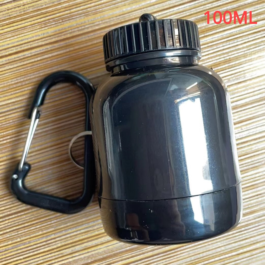 Portable Protein Powder Bottle with keychain attachment, built-in funnel, and medicine box, designed for storing and mixing protein powder and supplements, ideal for camping and outdoor activities. 