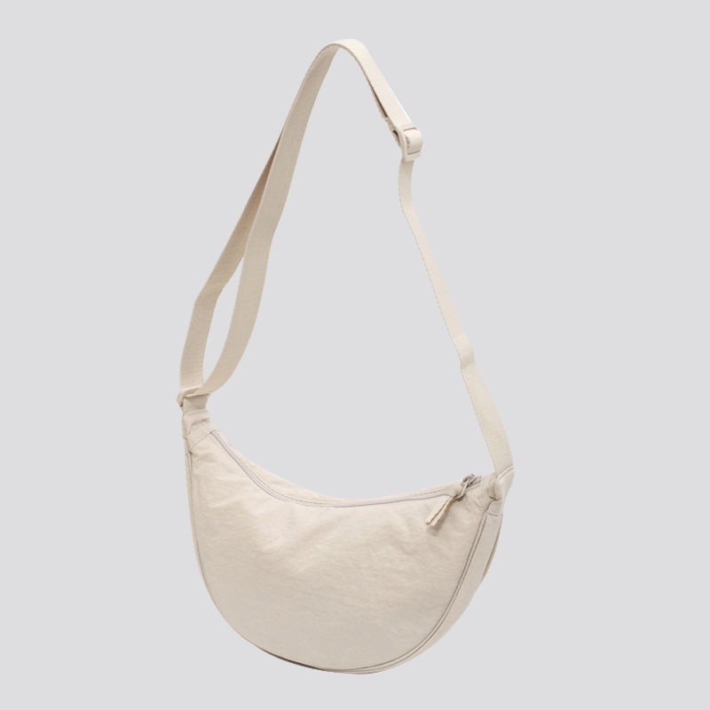 Elevate your style with the Simple Design Women's Messenger Bag, featuring classic and vintage charm. Perfect for all ages, this durable nylon bag combines practicality and fashion.