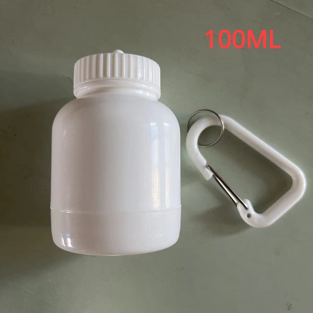 Portable Protein Powder Bottle with keychain attachment, built-in funnel, and medicine box, designed for storing and mixing protein powder and supplements, ideal for camping and outdoor activities. 