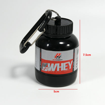 Portable Protein Powder Bottle with keychain attachment, built-in funnel, and medicine box, designed for storing and mixing protein powder and supplements, ideal for camping and outdoor activities. 