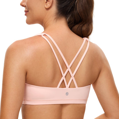 Low cut, wire-free sports bra with a strappy design and Naked Feeling fabric for a soft, lightweight, and comfortable fit. Ideal for low-impact activities