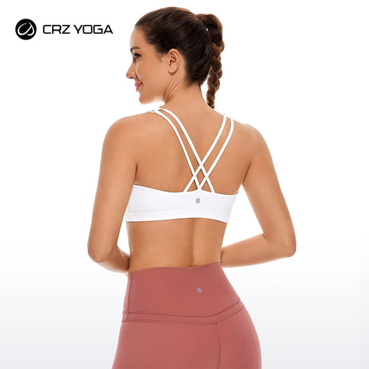 Low cut, wire-free sports bra with a strappy design and Naked Feeling fabric for a soft, lightweight, and comfortable fit. Ideal for low-impact activities