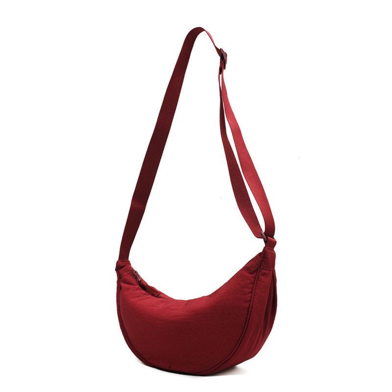 Elevate your style with the Simple Design Women's Messenger Bag, featuring classic and vintage charm. Perfect for all ages, this durable nylon bag combines practicality and fashion.