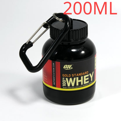 Portable Protein Powder Bottle with keychain attachment, built-in funnel, and medicine box, designed for storing and mixing protein powder and supplements, ideal for camping and outdoor activities. 