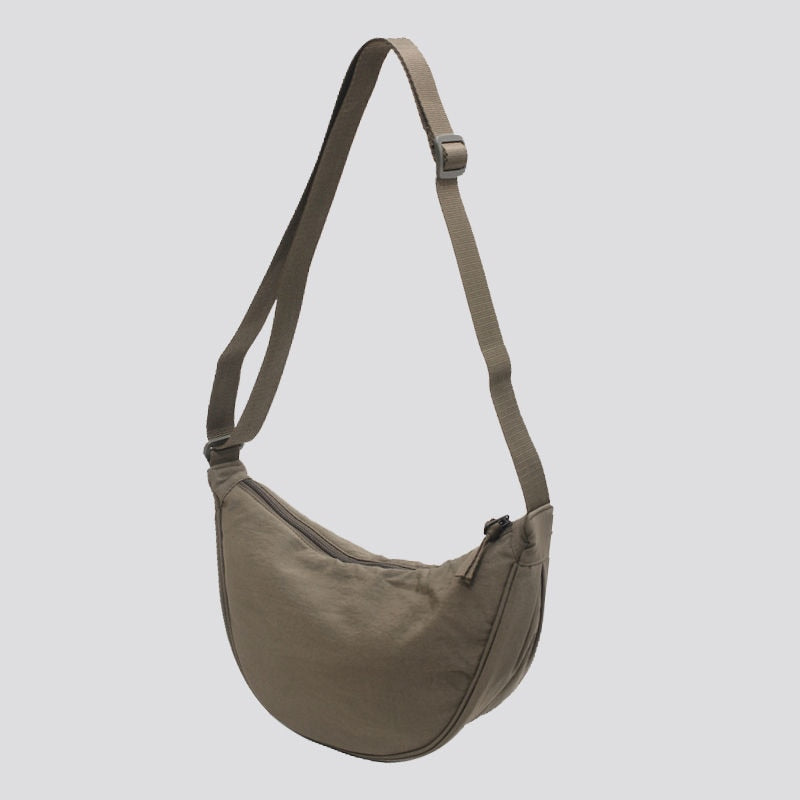 Elevate your style with the Simple Design Women's Messenger Bag, featuring classic and vintage charm. Perfect for all ages, this durable nylon bag combines practicality and fashion.