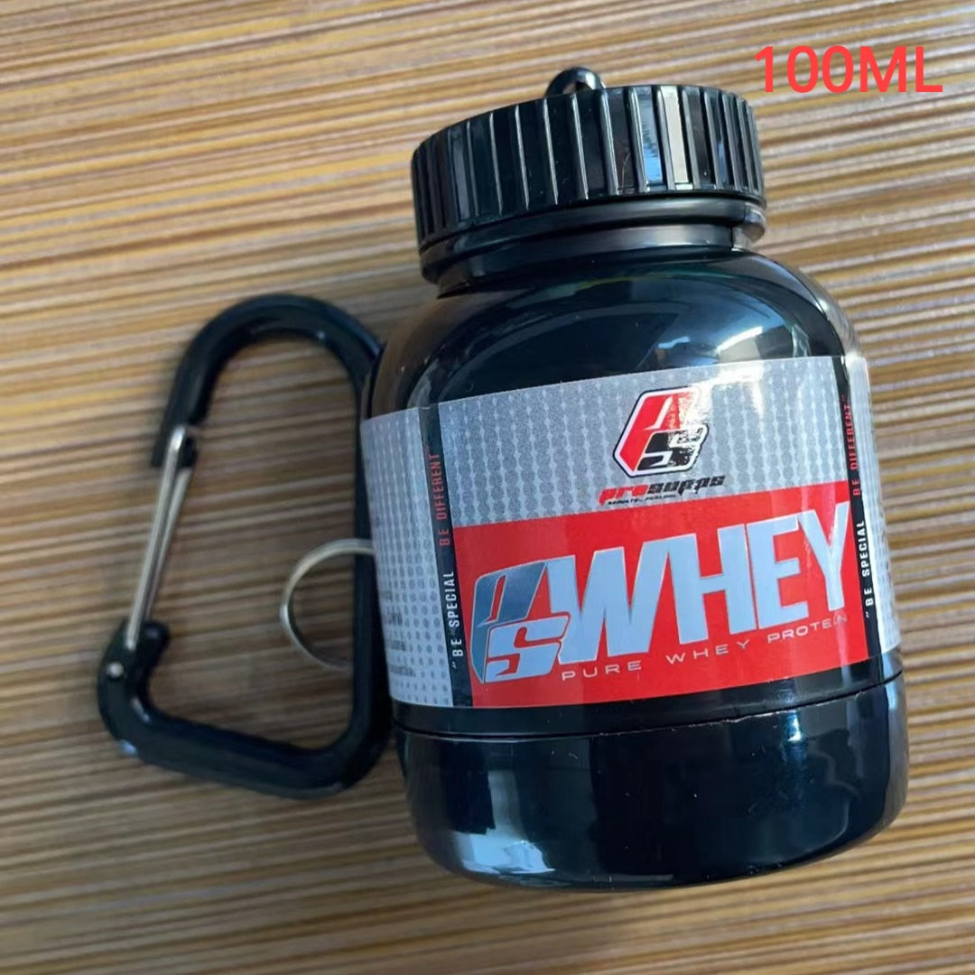 Portable Protein Powder Bottle with keychain attachment, built-in funnel, and medicine box, designed for storing and mixing protein powder and supplements, ideal for camping and outdoor activities. 