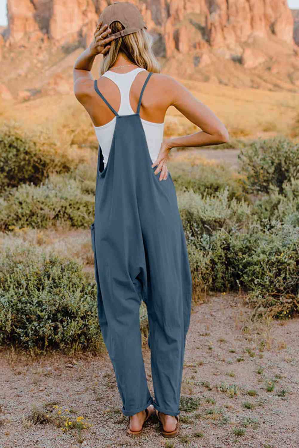 Double Take V-Neck Sleeveless Jumpsuit with Pocket – a blend of effortless elegance and modern chic. Made from luxurious, breathable fabric, it features a flattering V-neckline and a tailored silhouette that beautifully accentuates your figure.