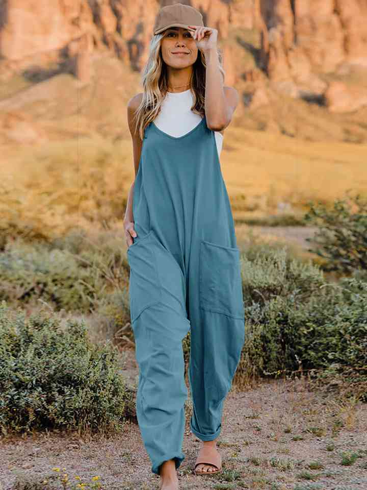 Double Take V-Neck Sleeveless Jumpsuit with Pocket – a blend of effortless elegance and modern chic. Made from luxurious, breathable fabric, it features a flattering V-neckline and a tailored silhouette that beautifully accentuates your figure.