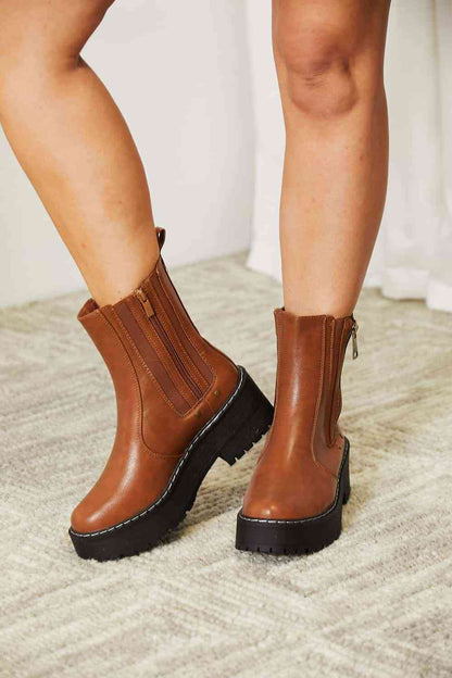 Side zip platform boots: stylish, practical, convenient, and durable for any outfit and terrain.