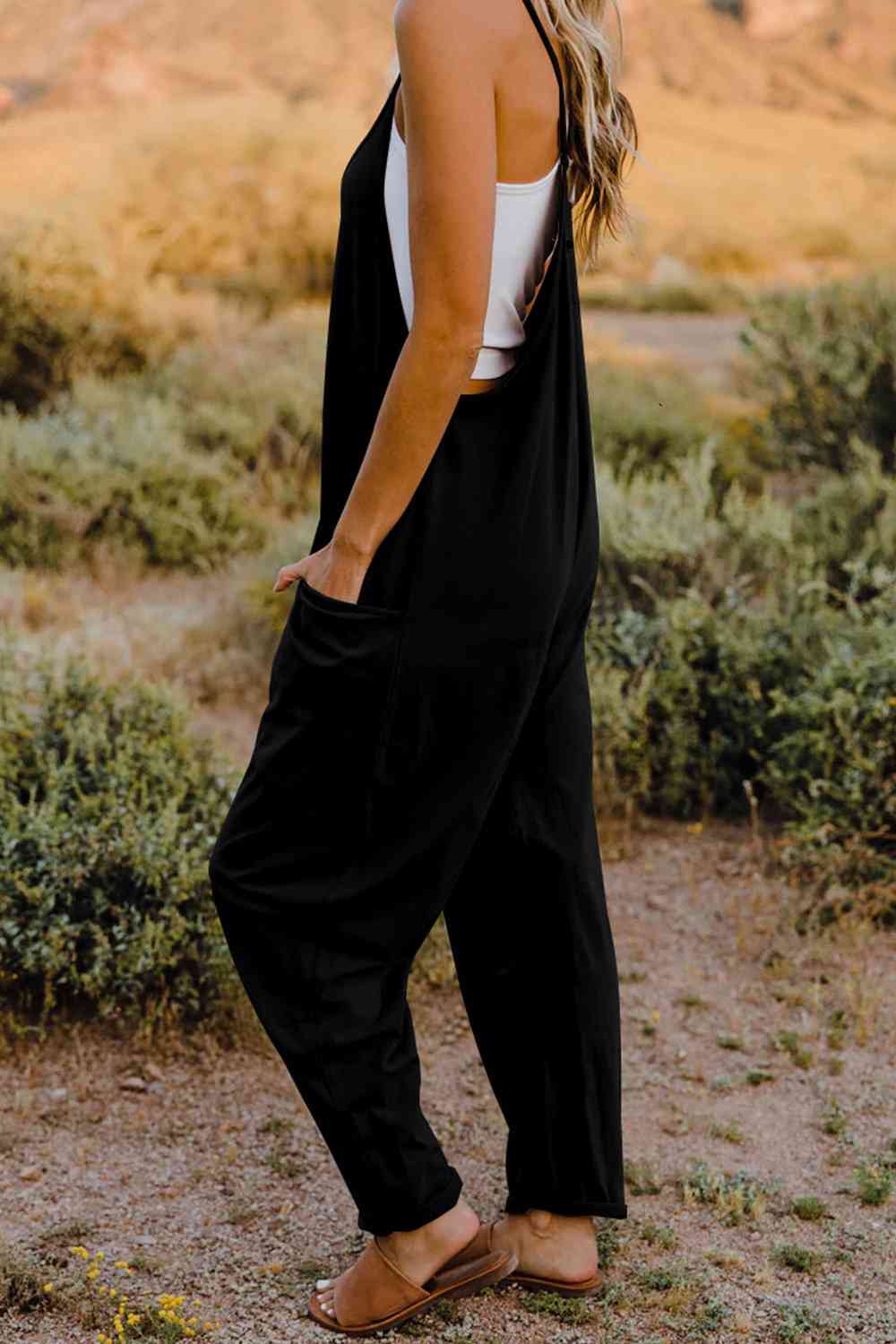 Double Take V-Neck Sleeveless Jumpsuit with Pocket – a blend of effortless elegance and modern chic. Made from luxurious, breathable fabric, it features a flattering V-neckline and a tailored silhouette that beautifully accentuates your figure.