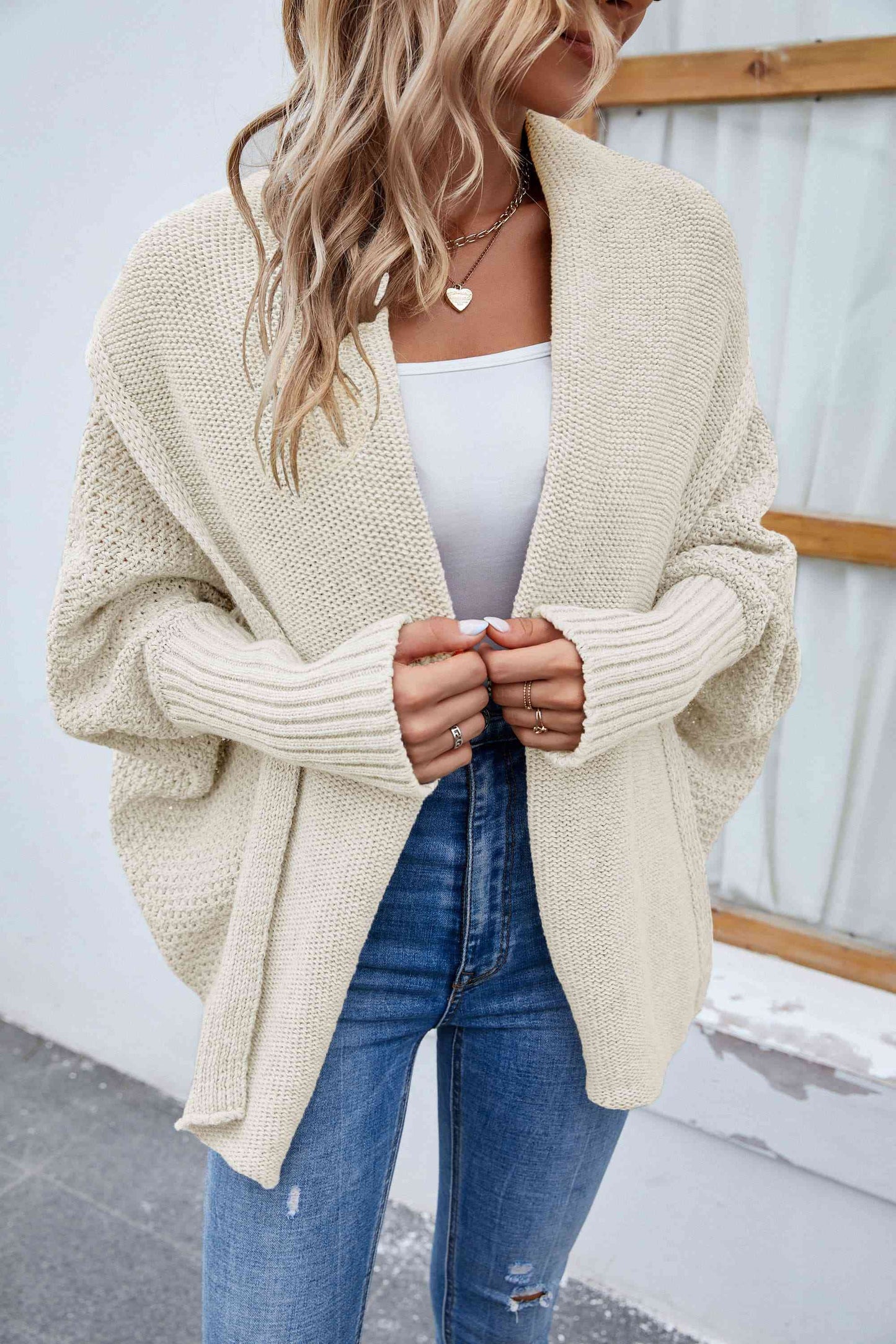  Open-front long sleeve cardigan: casual elegance, 65% polyester, 35% acrylic, comfortable, durable, solid pattern, versatile wardrobe staple.