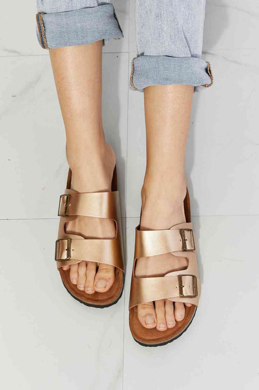 Double-banded slide sandals give a luxe look with their faux leather upper and cork sole. Their comfy design is perfect for wearing for almost any summer adventure. 