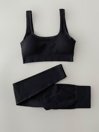 Two-piece Yoga Clothing Set with high-waisted, seamless leggings and a versatile, airy top for comfort and style during any workout.