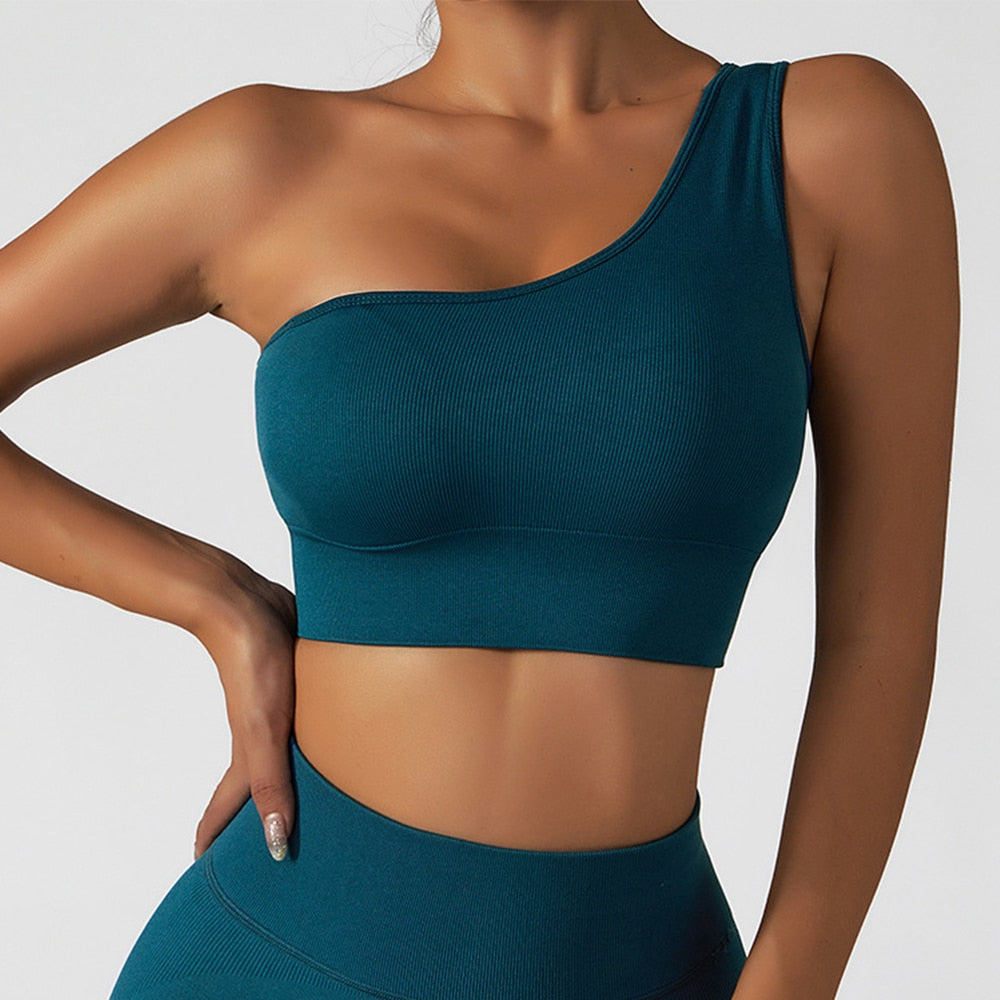  Summer Sexy Oblique Shoulder Yoga Top with asymmetrical design, irregular straps, and push-up feature for style and support. Lightweight and breathable fabric.