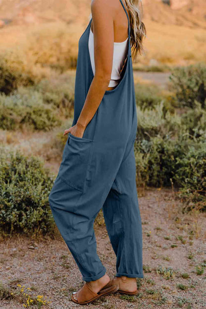 Double Take V-Neck Sleeveless Jumpsuit with Pocket – a blend of effortless elegance and modern chic. Made from luxurious, breathable fabric, it features a flattering V-neckline and a tailored silhouette that beautifully accentuates your figure.