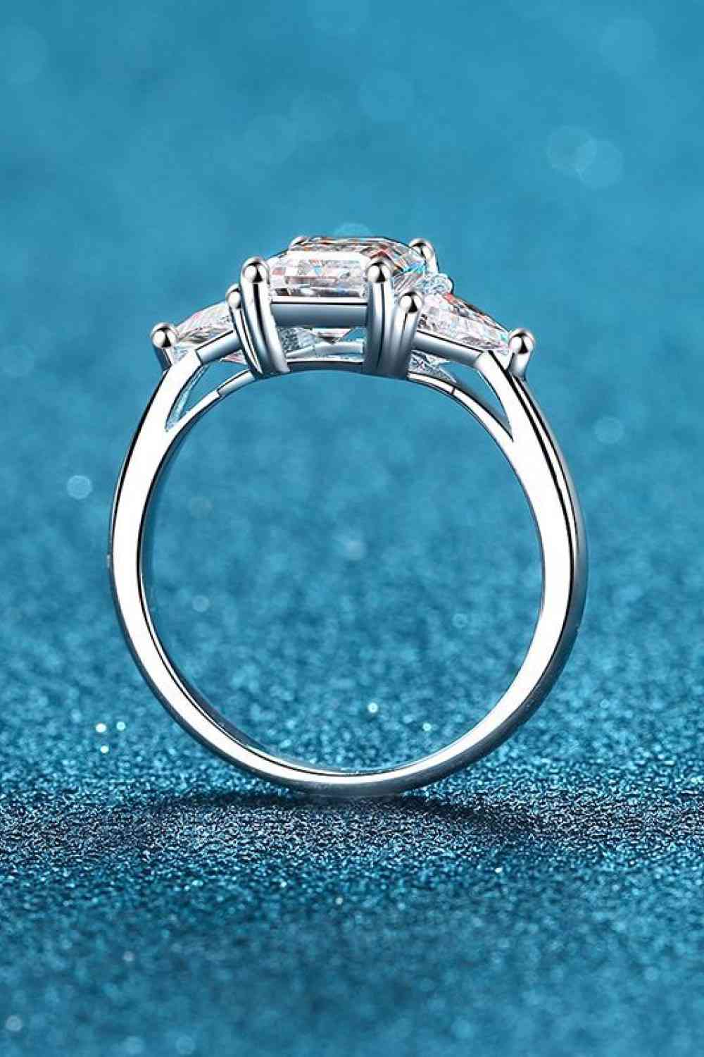 925 sterling silver and moissanite ring with platinum plating, featuring a sleek, minimalist design and brilliant shine.