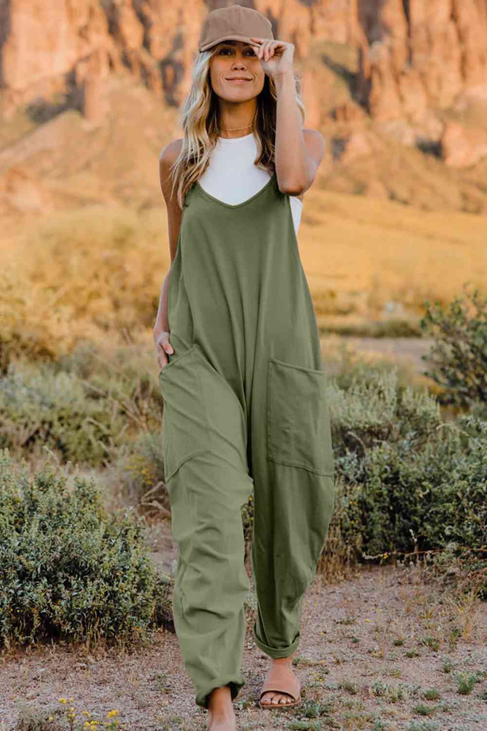 Double Take V-Neck Sleeveless Jumpsuit with Pocket – a blend of effortless elegance and modern chic. Made from luxurious, breathable fabric, it features a flattering V-neckline and a tailored silhouette that beautifully accentuates your figure.