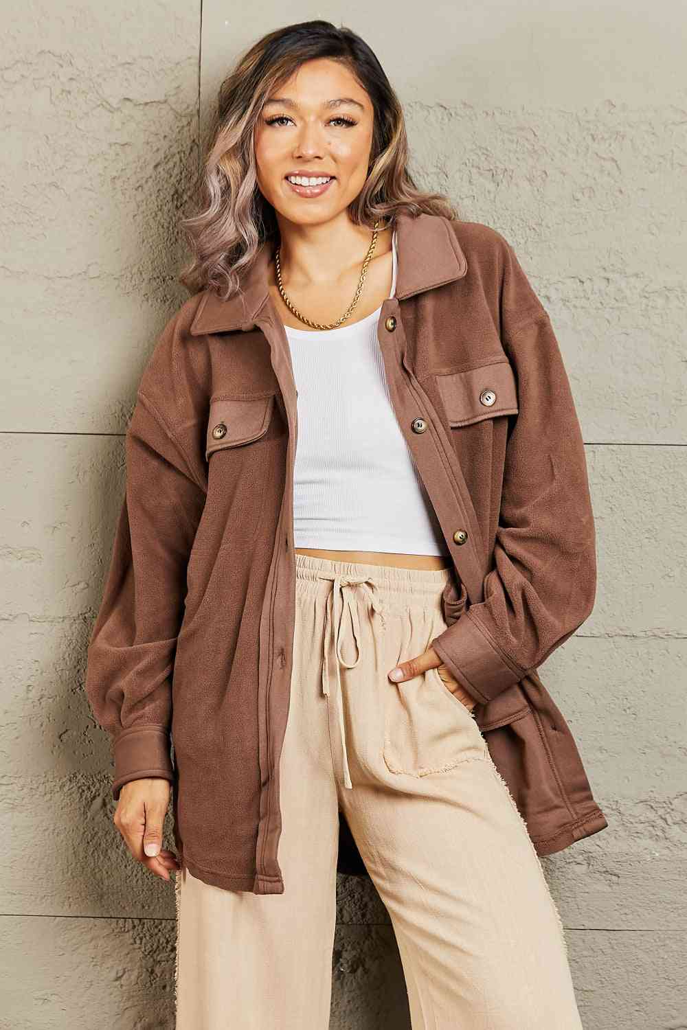  Versatile shacket: unique tunic detail, front and side pockets, button-down front, classic collar, long puff sleeves.