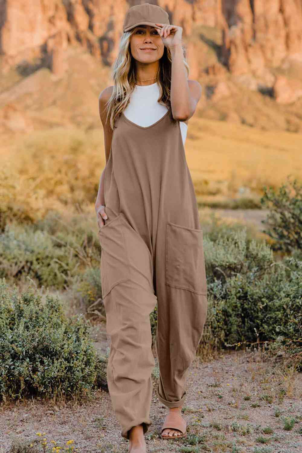 Double Take V-Neck Sleeveless Jumpsuit with Pocket – a blend of effortless elegance and modern chic. Made from luxurious, breathable fabric, it features a flattering V-neckline and a tailored silhouette that beautifully accentuates your figure.