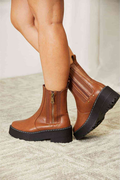 Side zip platform boots: stylish, practical, convenient, and durable for any outfit and terrain.