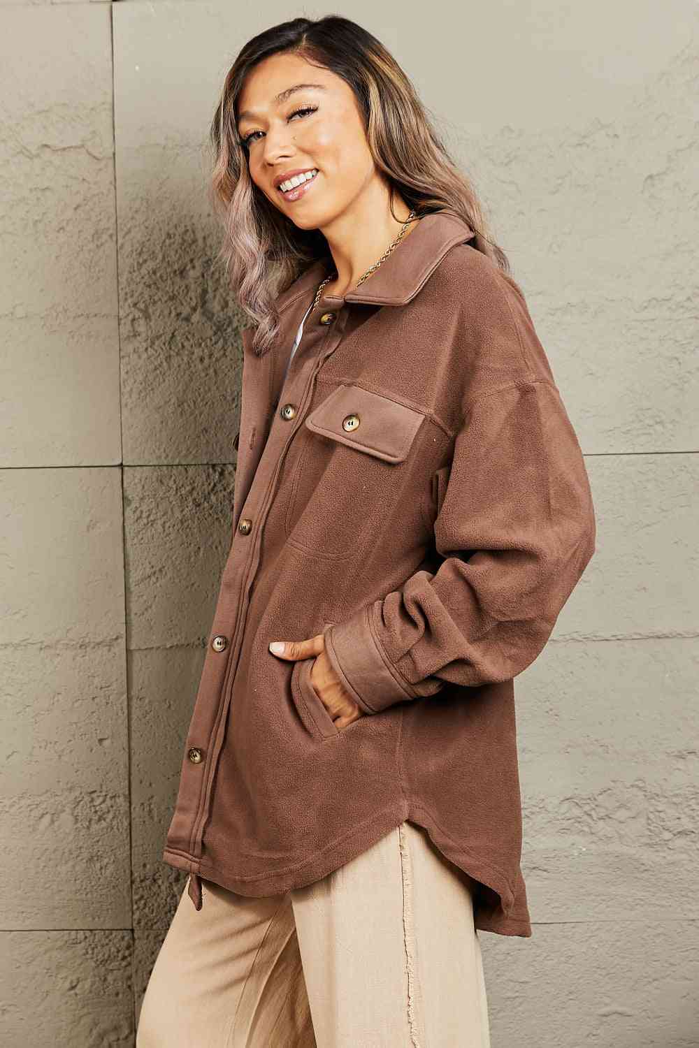  Versatile shacket: unique tunic detail, front and side pockets, button-down front, classic collar, long puff sleeves.