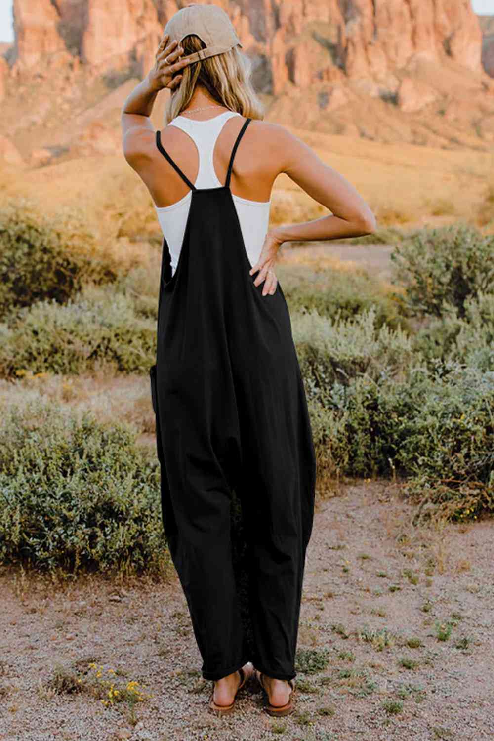 Double Take V-Neck Sleeveless Jumpsuit with Pocket – a blend of effortless elegance and modern chic. Made from luxurious, breathable fabric, it features a flattering V-neckline and a tailored silhouette that beautifully accentuates your figure.