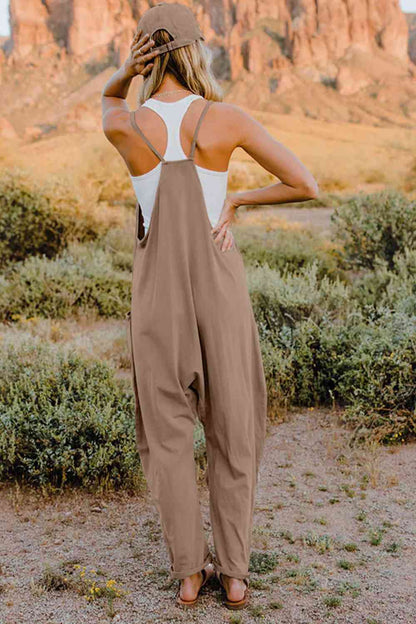 Double Take V-Neck Sleeveless Jumpsuit with Pocket – a blend of effortless elegance and modern chic. Made from luxurious, breathable fabric, it features a flattering V-neckline and a tailored silhouette that beautifully accentuates your figure.