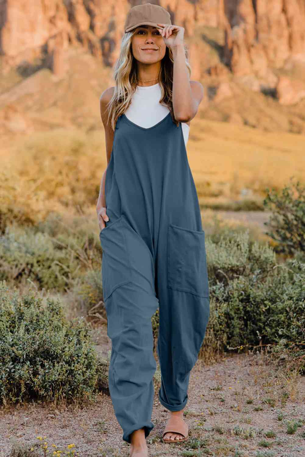 Double Take V-Neck Sleeveless Jumpsuit with Pocket – a blend of effortless elegance and modern chic. Made from luxurious, breathable fabric, it features a flattering V-neckline and a tailored silhouette that beautifully accentuates your figure.