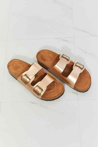 Double-banded slide sandals give a luxe look with their faux leather upper and cork sole. Their comfy design is perfect for wearing for almost any summer adventure. 