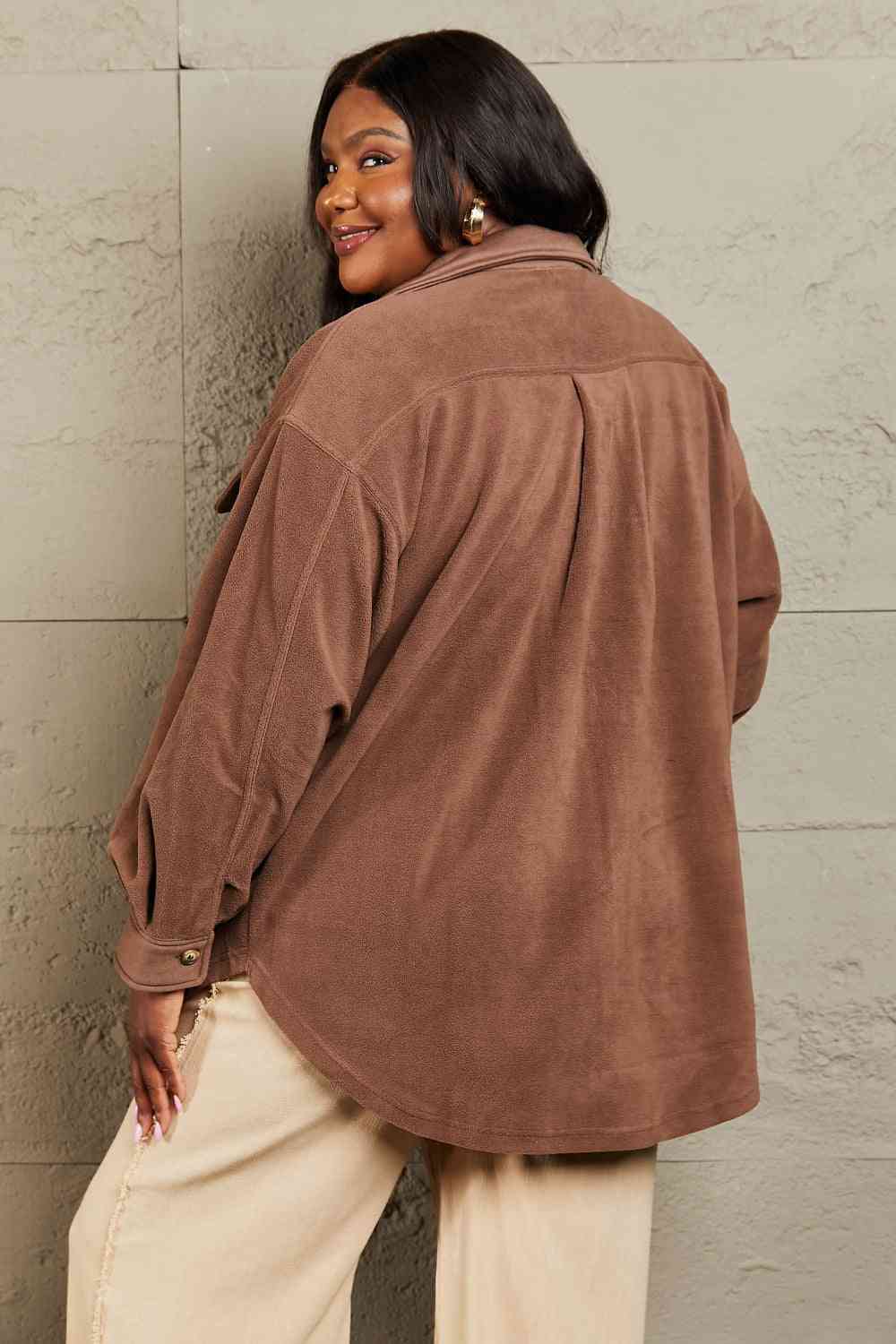  Versatile shacket: unique tunic detail, front and side pockets, button-down front, classic collar, long puff sleeves.